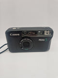 Canon Prima 5 sett forfra med objektivdeksel lukket.
