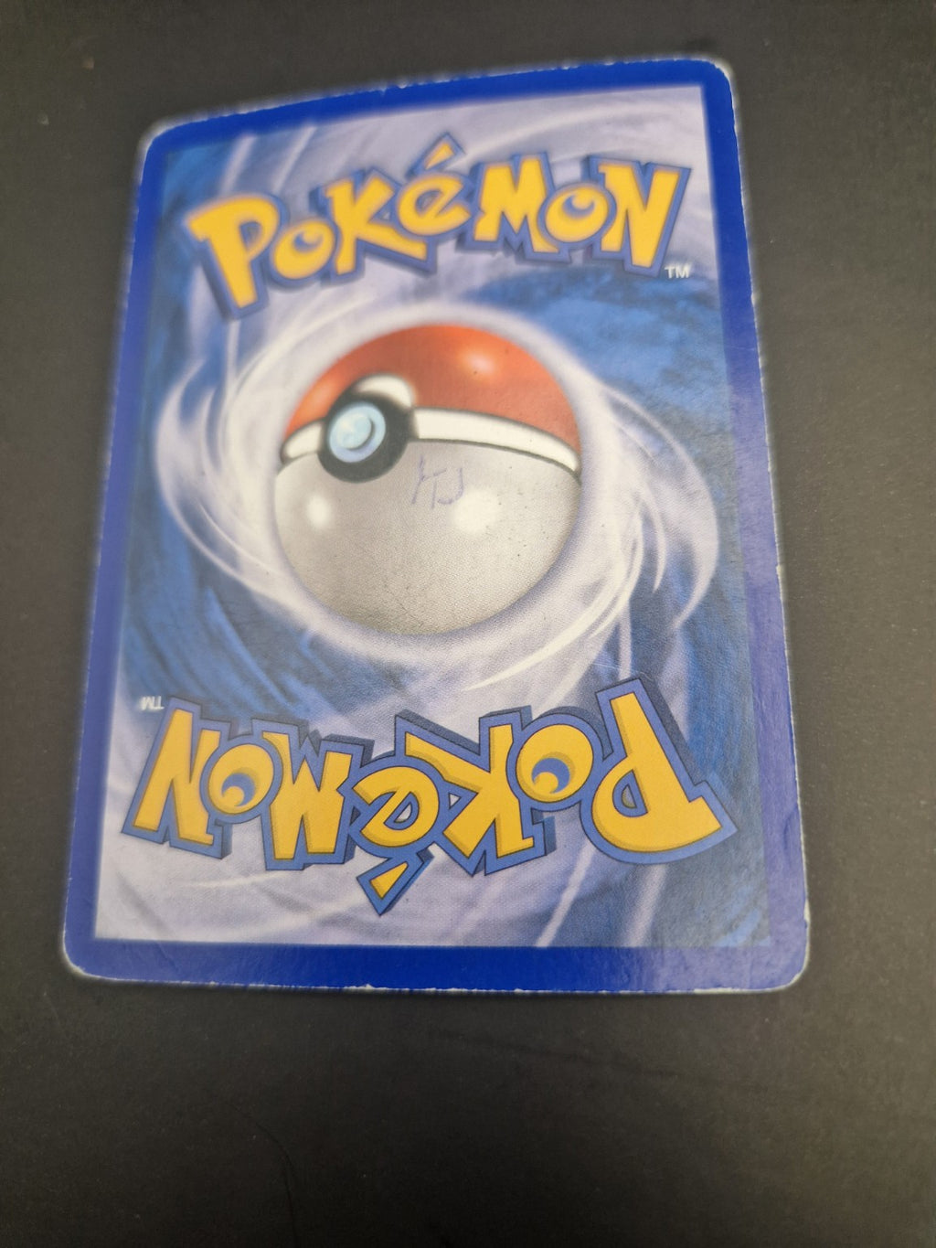 3. Bakside av Meganium ex med håndskrift og generell slitasje.
