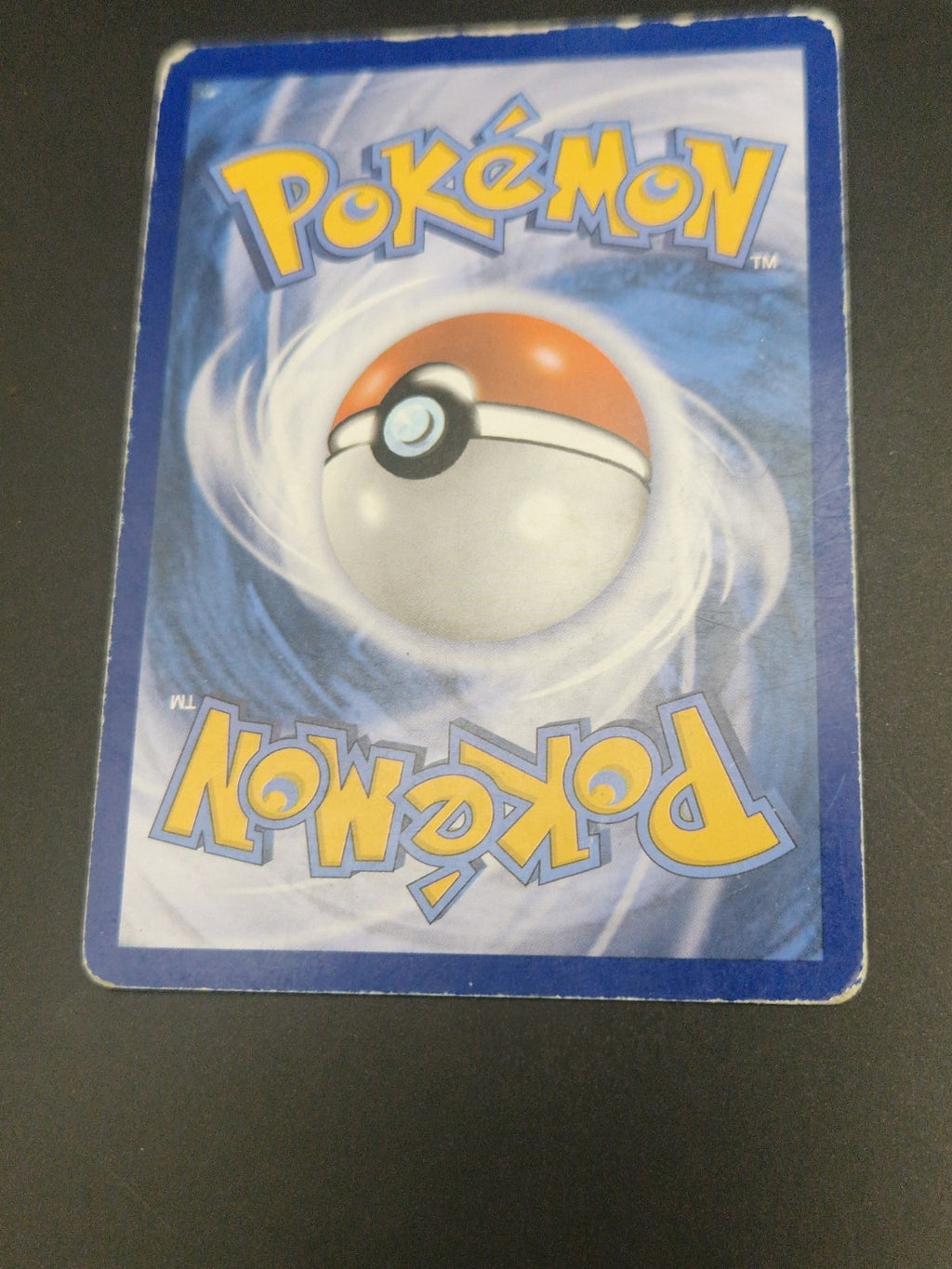2. Bakside av M Gengar EX 121/119 som viser kortets tilstand.
