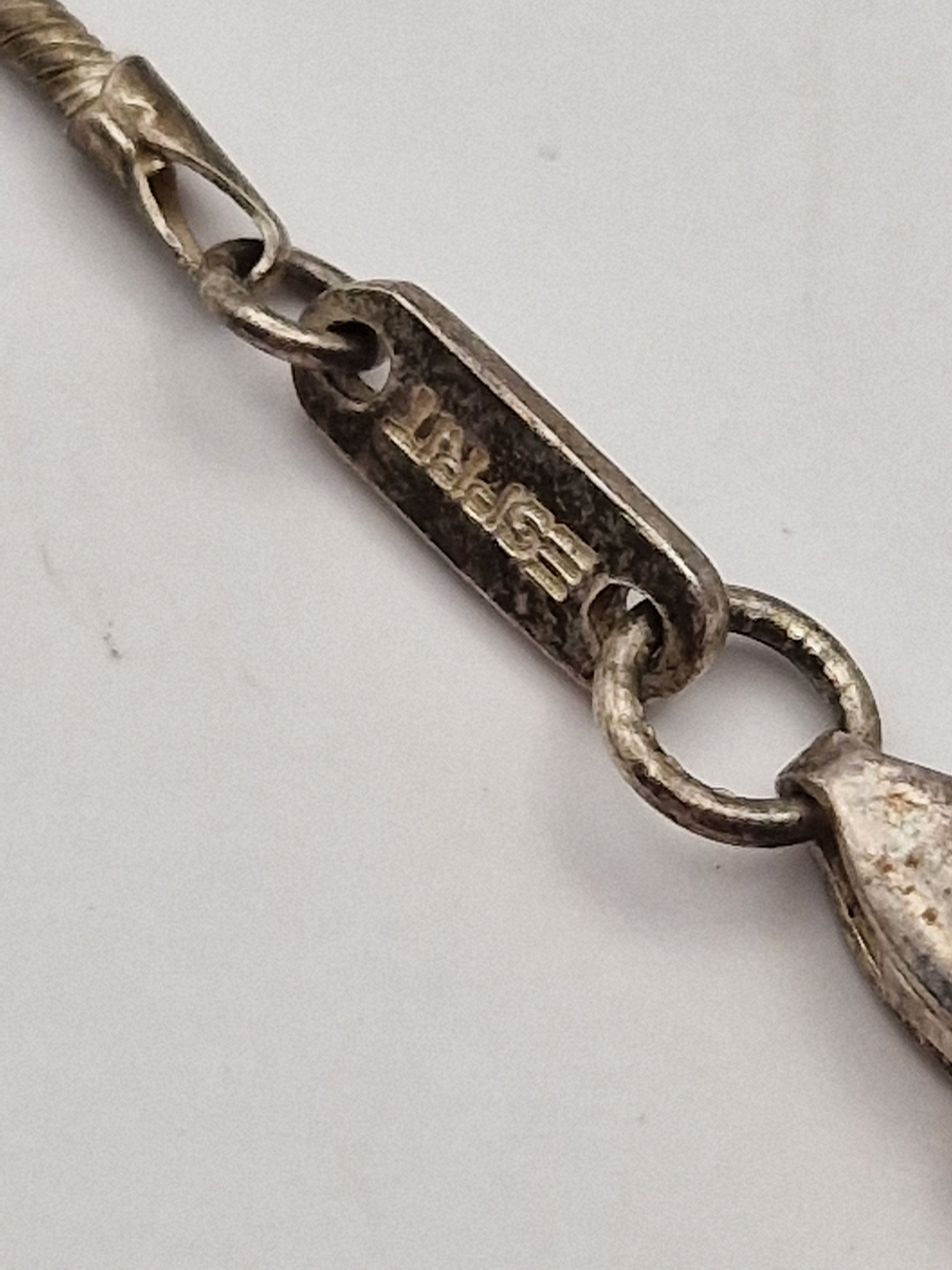 925-stempel og Esprit-merking på sølvsmykke