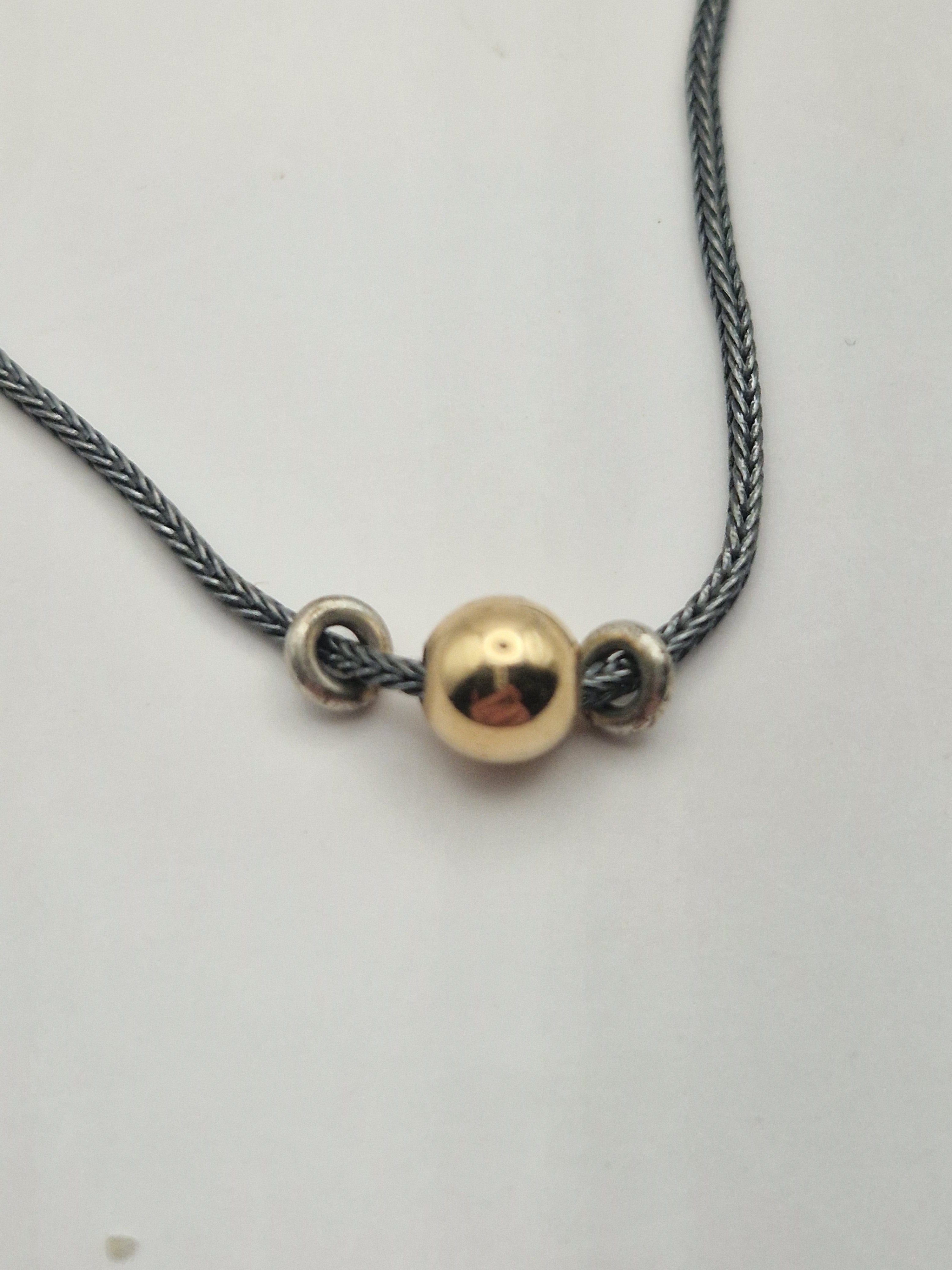 Detalj av kule og lenke