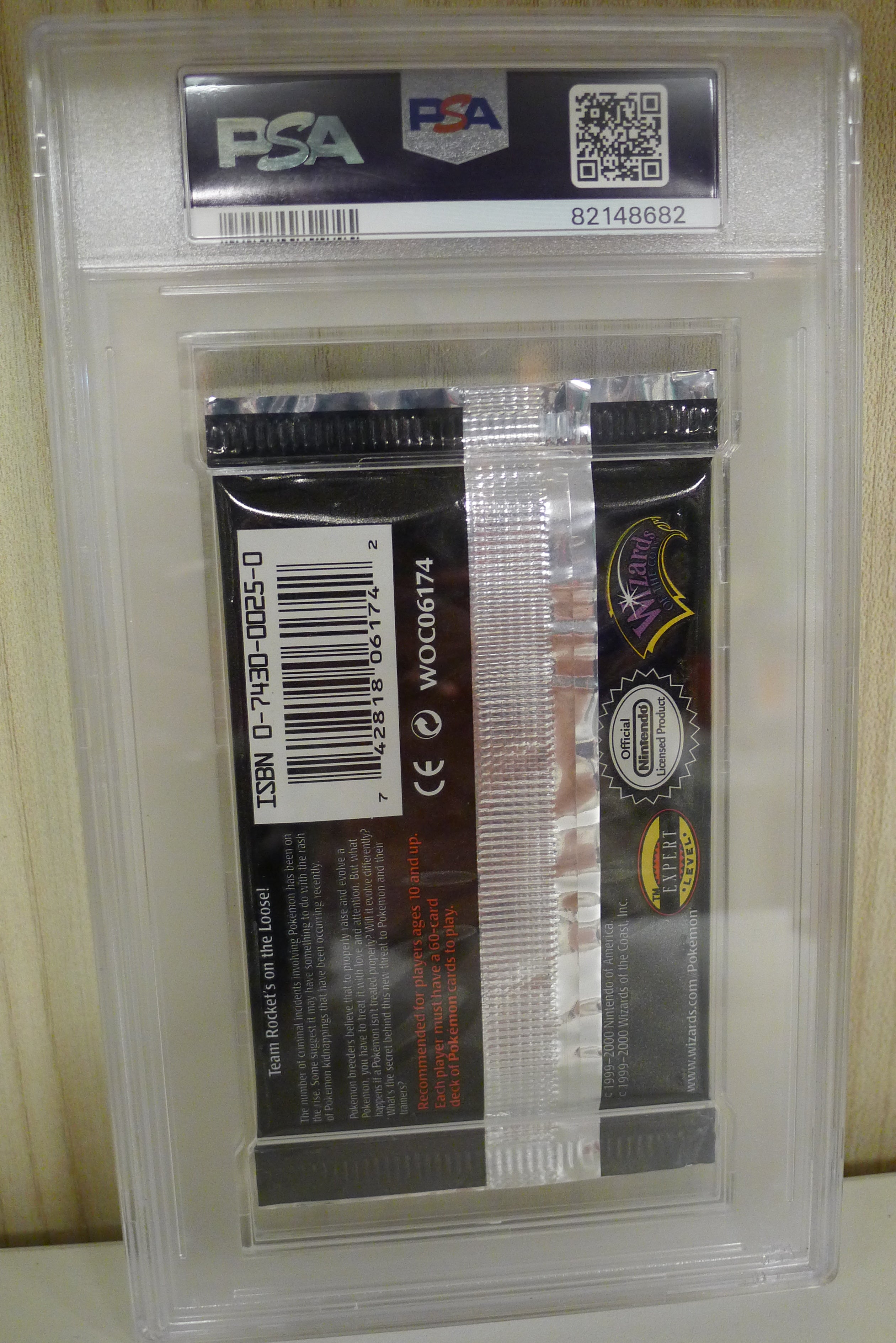alt="Pokemon Team Rocket 1st Edition Booster Pack PSA 10 WOTC 2000