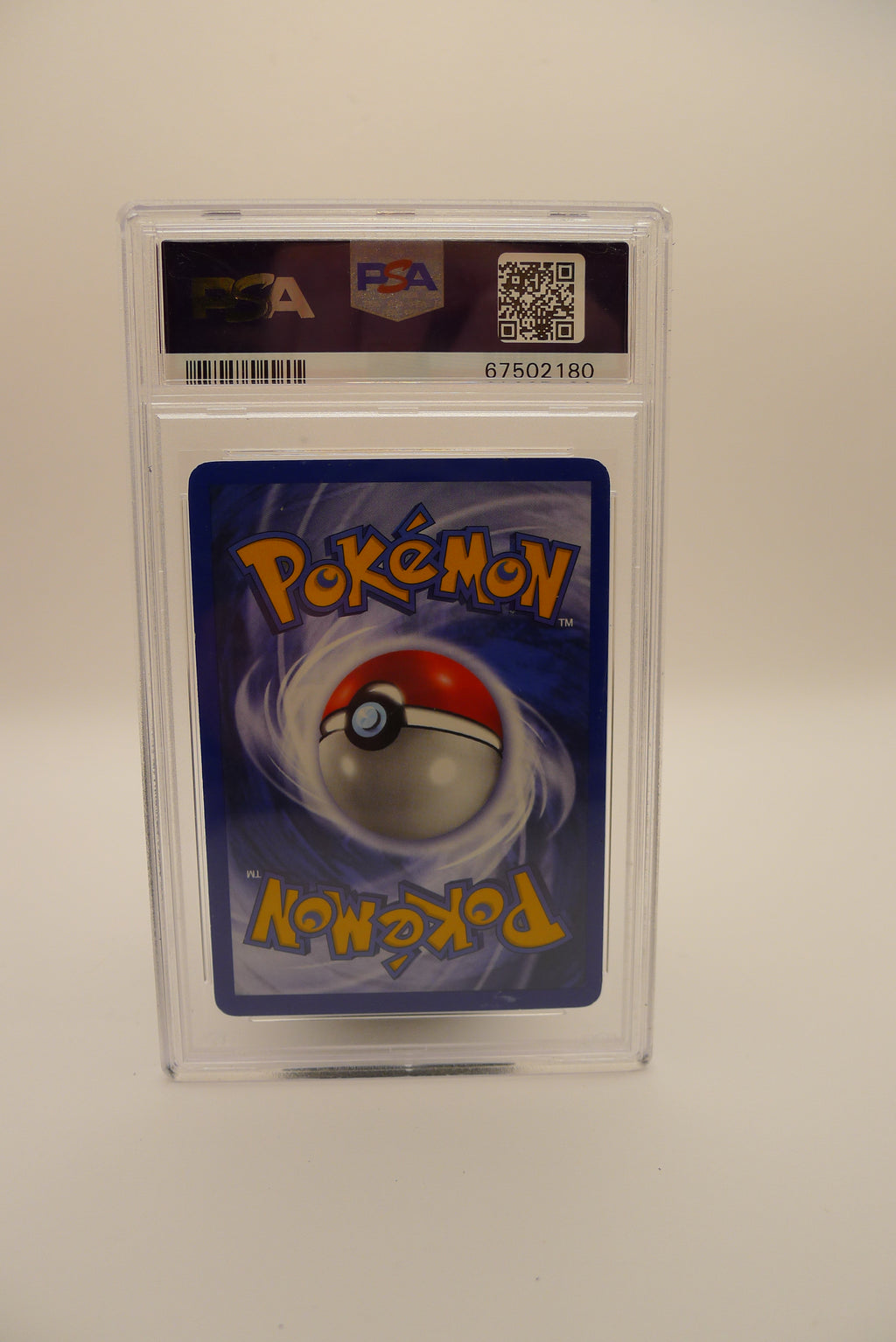 PSA 7 Dark Charizard fra Pokémon Team Rocket (2000). Klassisk og ettertraktet samlekort.