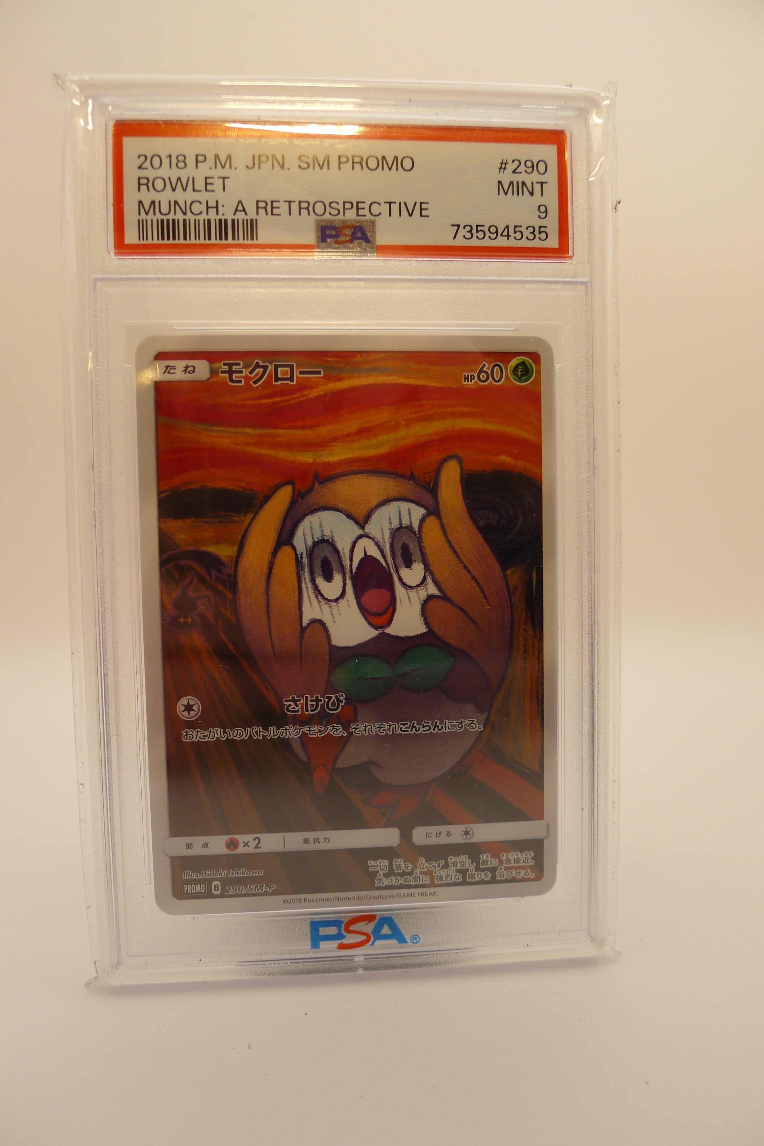 PSA 9 Mint Rowlet Munch: A Retrospective japansk promo 2018, gradert av PSA.