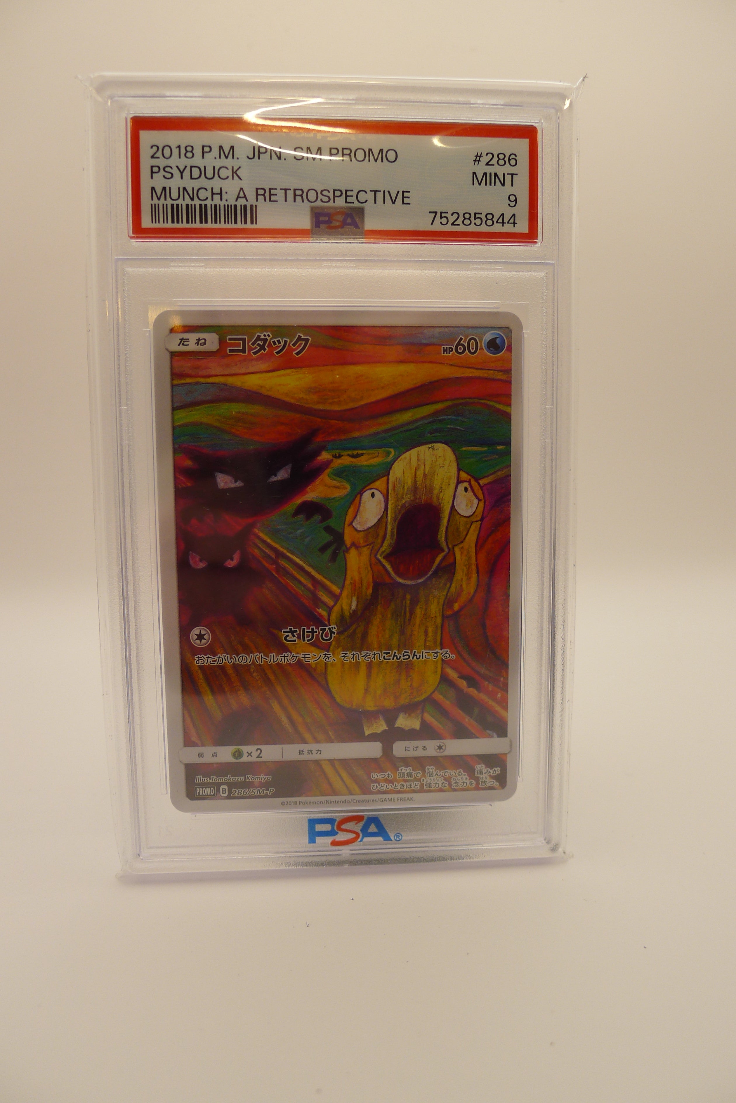 PSA 9 Mint Psyduck Munch: A Retrospective japansk promo med ikonisk kunst.