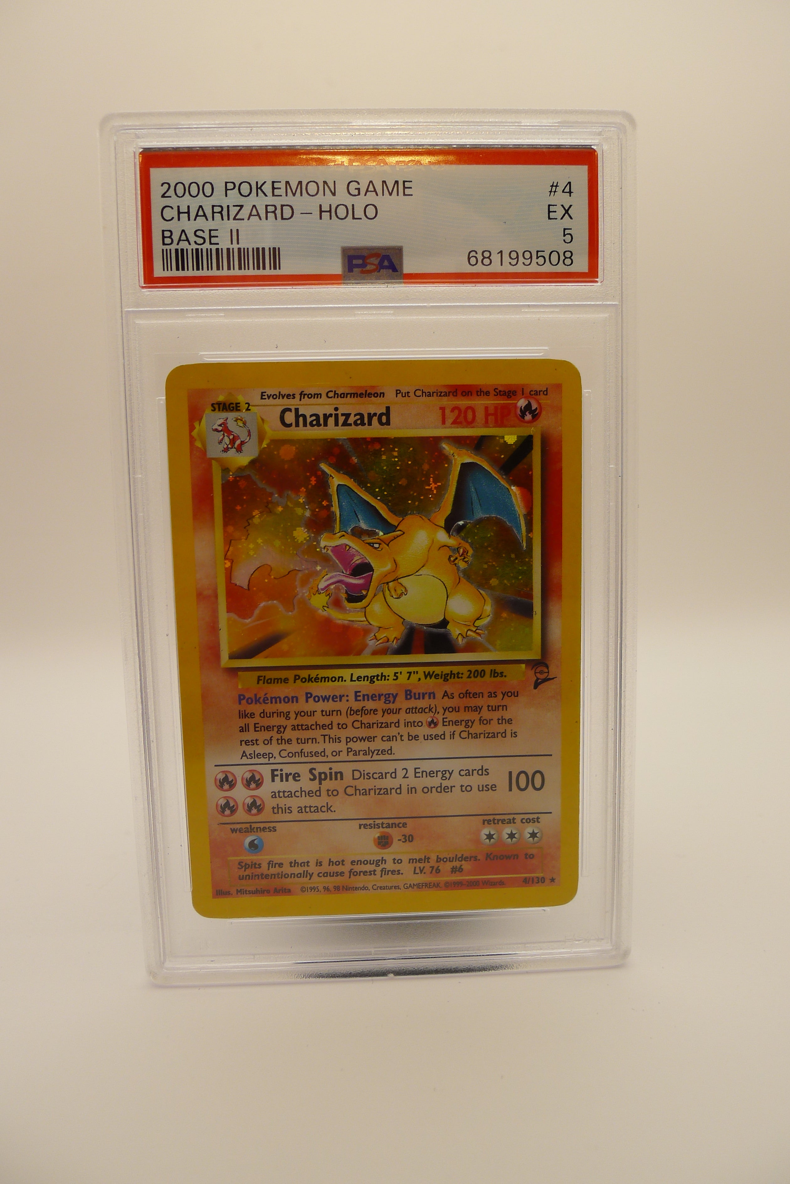 PSA 5 EX Charizard holografisk kort fra Pokémon Base Set 2 (2000).