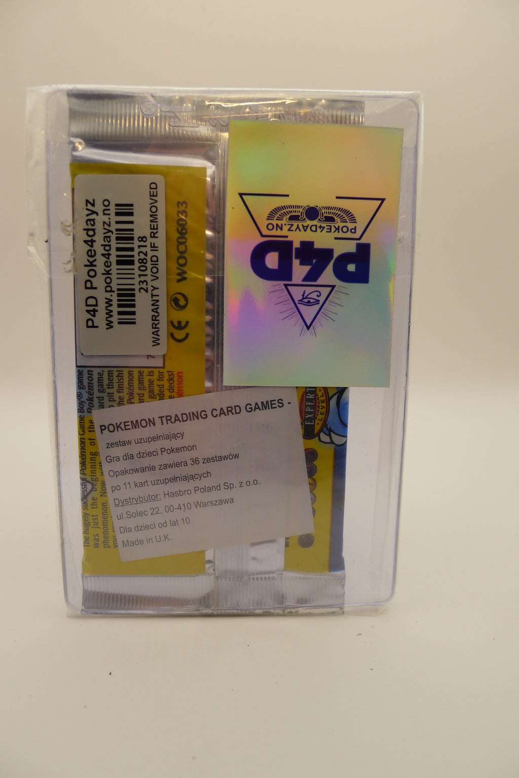 Bakside av Pokémon Base Set Booster Pack – forsegling, strekkode og original WOTC-tekst synlig.